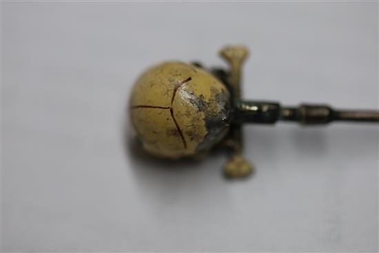 A 19th century French? base metal and cream enamel skull head stick pin, in the manner of Trouve & Cadet-Picard, overall 73mm.